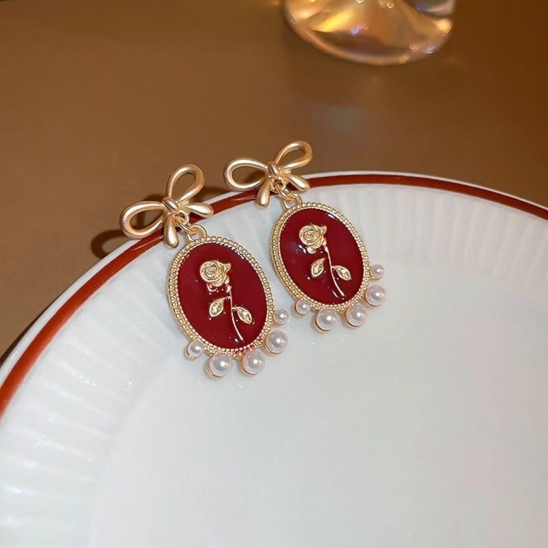 Gilded Garnet Cameos Earrings
