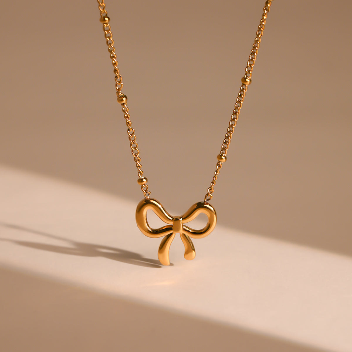 Golden Bow Serenade Neckpiece
