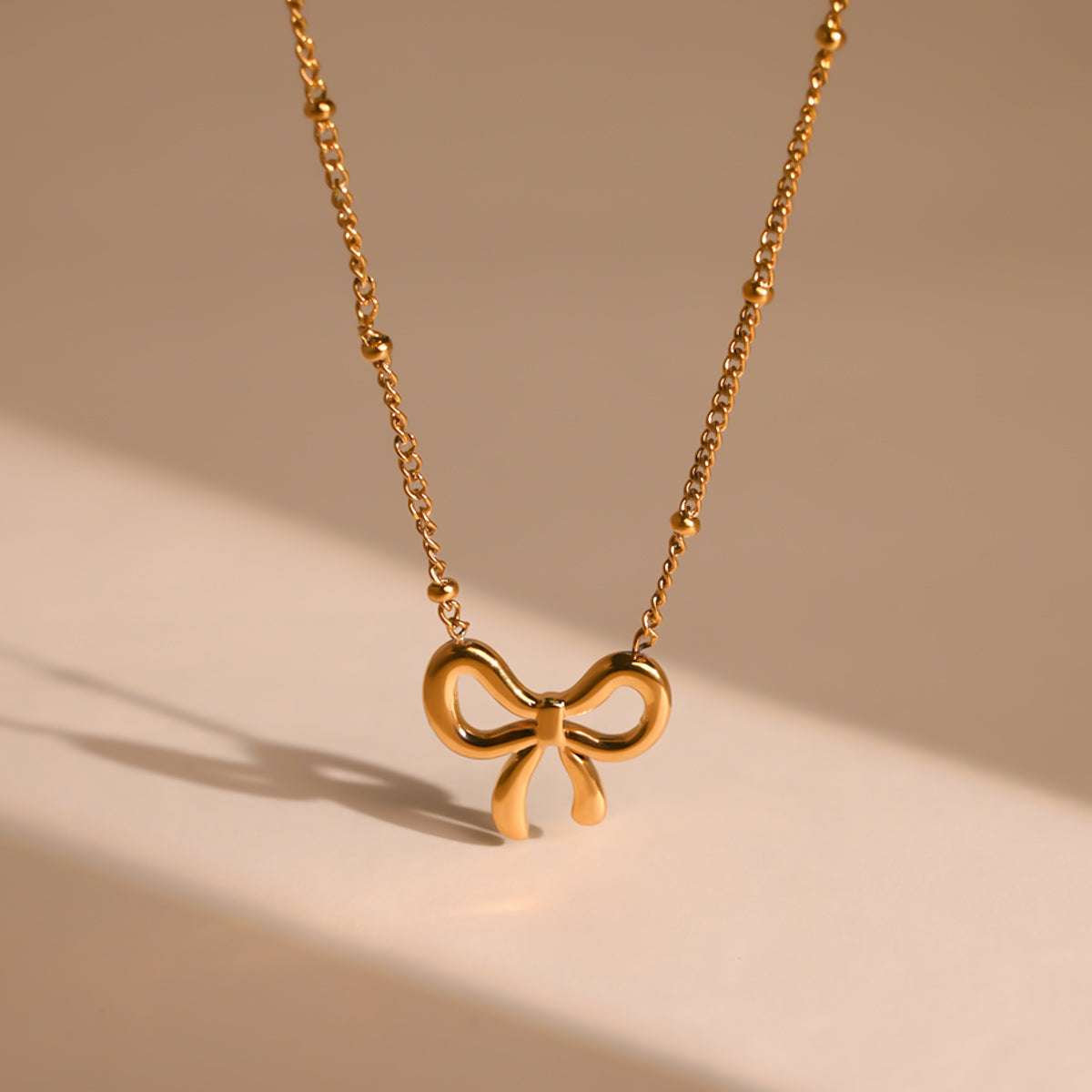 Golden Bow Serenade Neckpiece