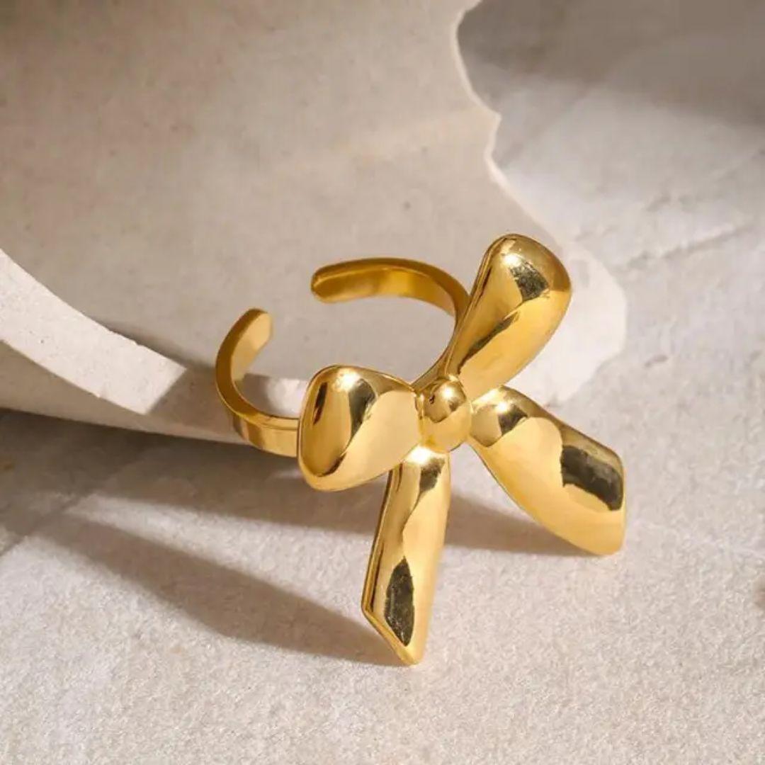 As pretty golden bow ring