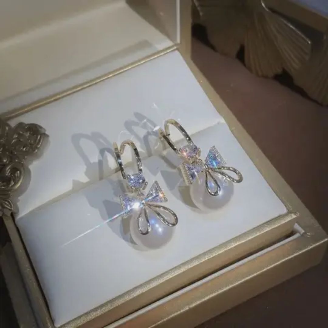 Perky Pearl Bow Stud Earrings
