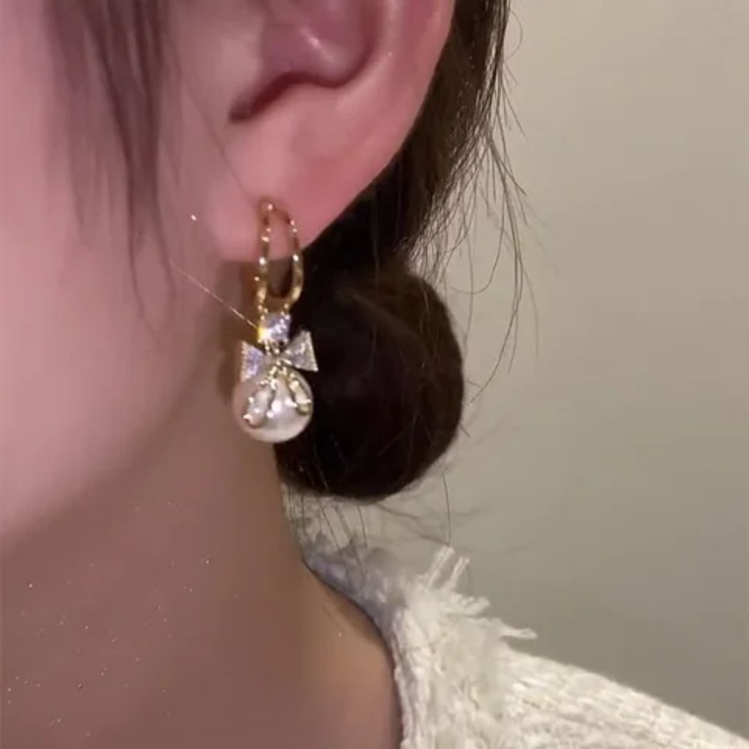 Perky Pearl Bow Stud Earrings