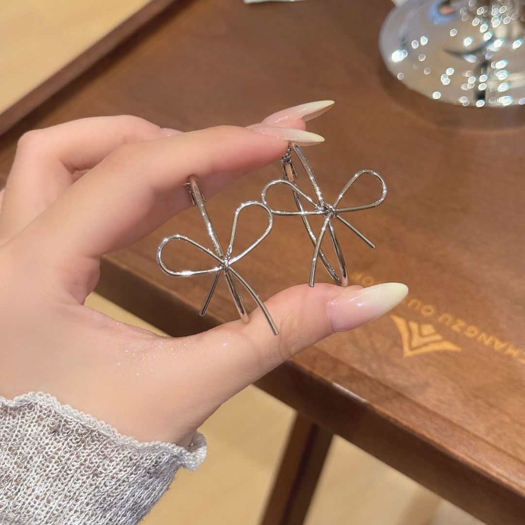 Sleek Silver Bow Earrings