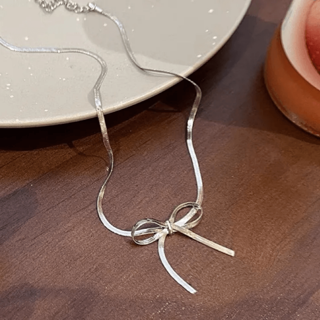 Silver Bow Statement Neckpiece