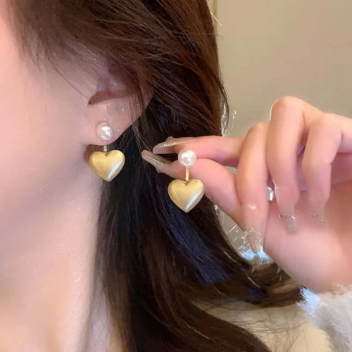 A pearl of golden heart earrings