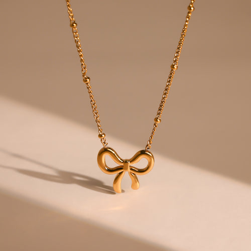 Golden Bow Serenade Neckpiece