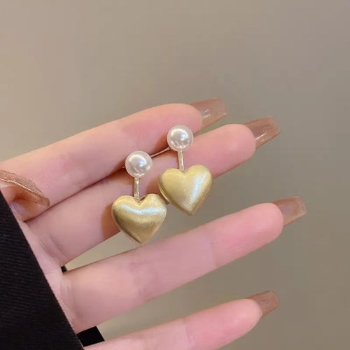 A pearl of golden heart earrings
