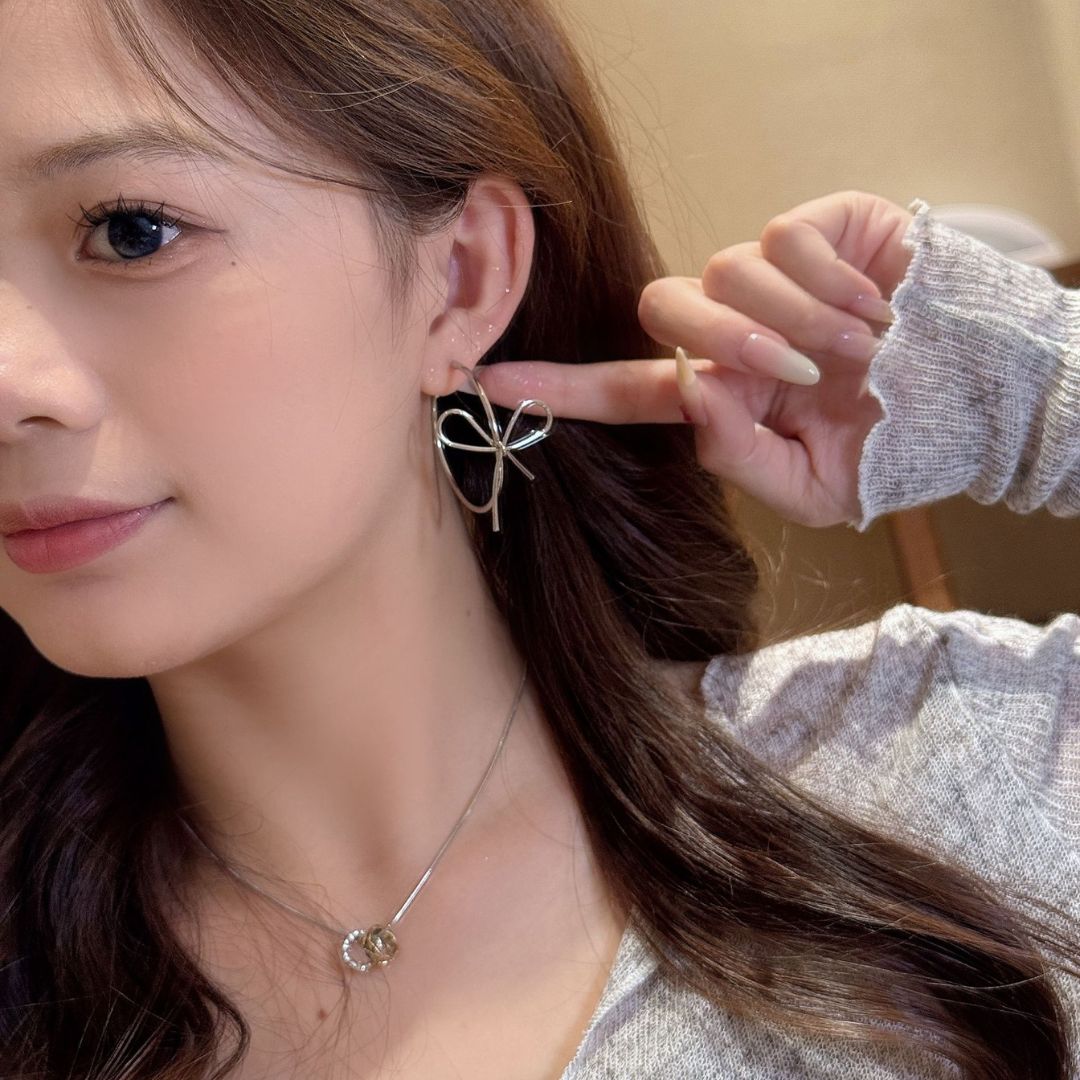 Sleek Silver Bow Earrings