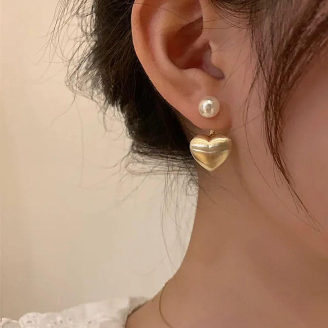 A pearl of golden heart earrings