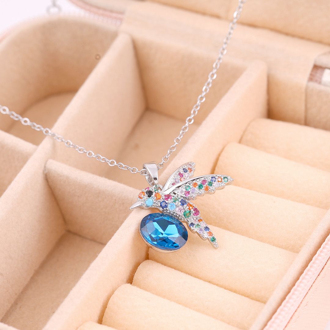 Bird charm necklace