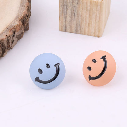 Mismatched smiley earrings