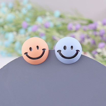 Mismatched smiley earrings